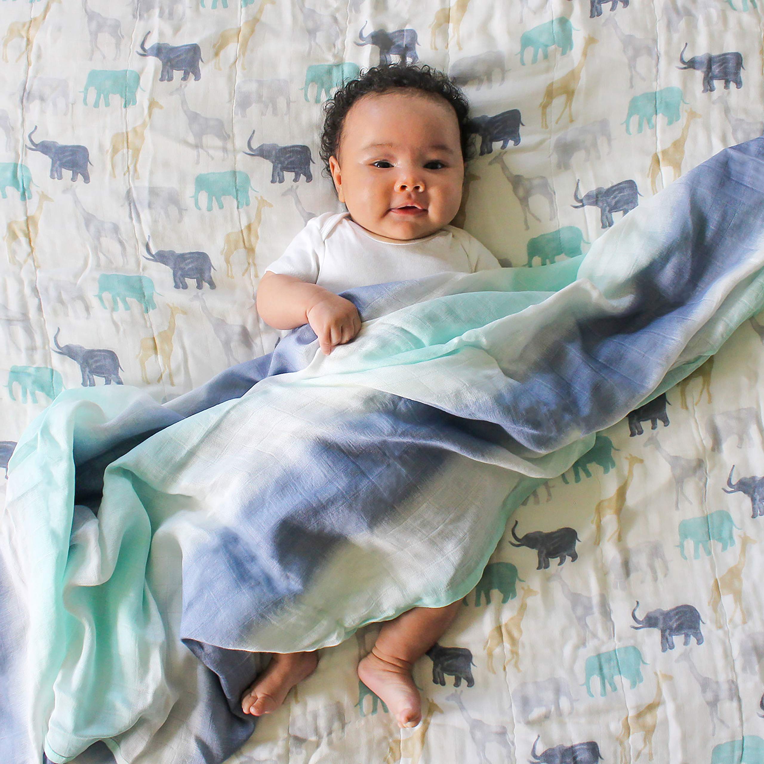 aden + anais Silky Soft Dream Blanket giraffes pattern, soft drape for on-the-go comfort.