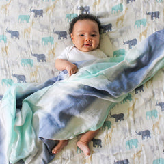 aden + anais Silky Soft Dream Blanket giraffes pattern, soft drape for on-the-go comfort.
