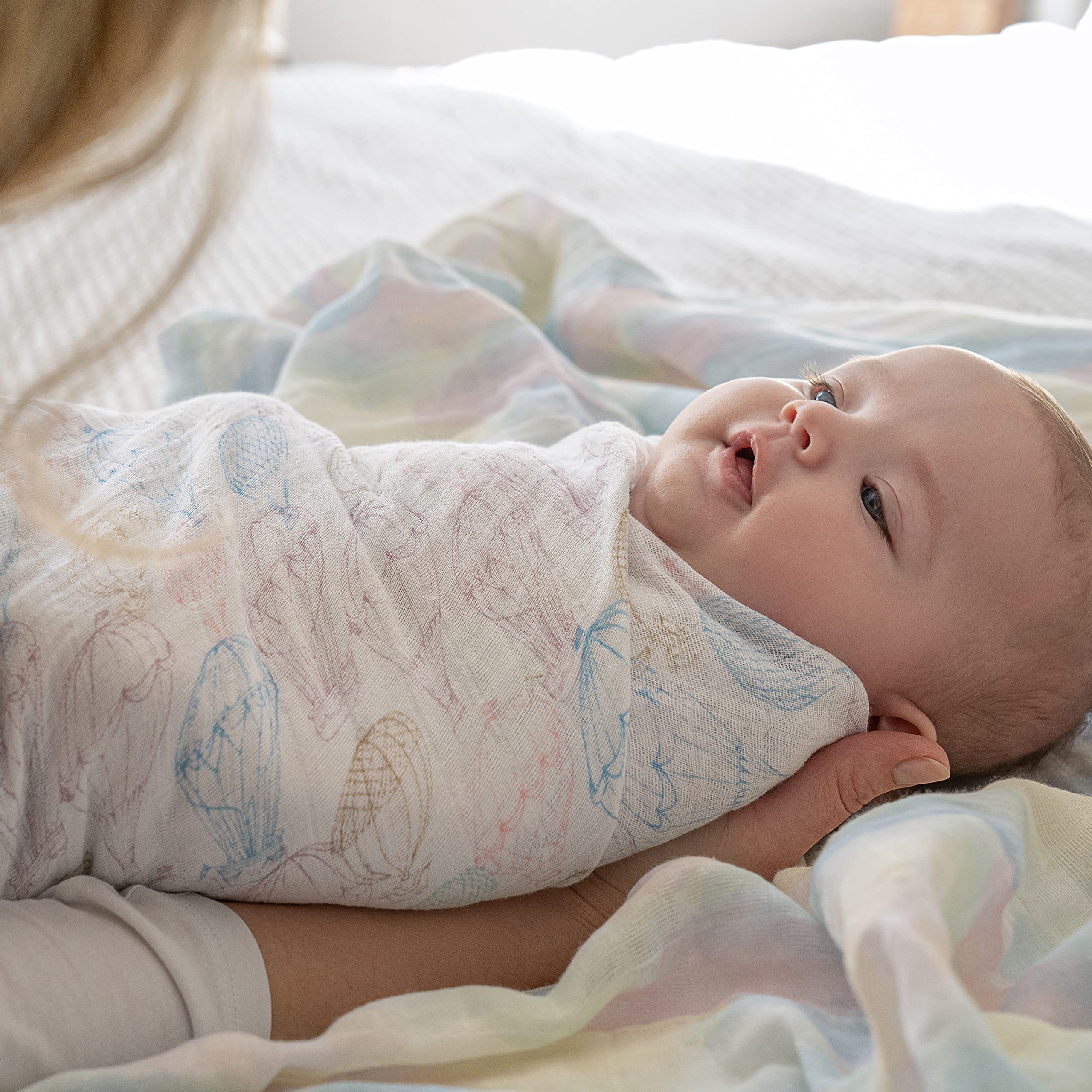 aden + anais swaddle blanket used as nursing cover for discreet feeding on the go