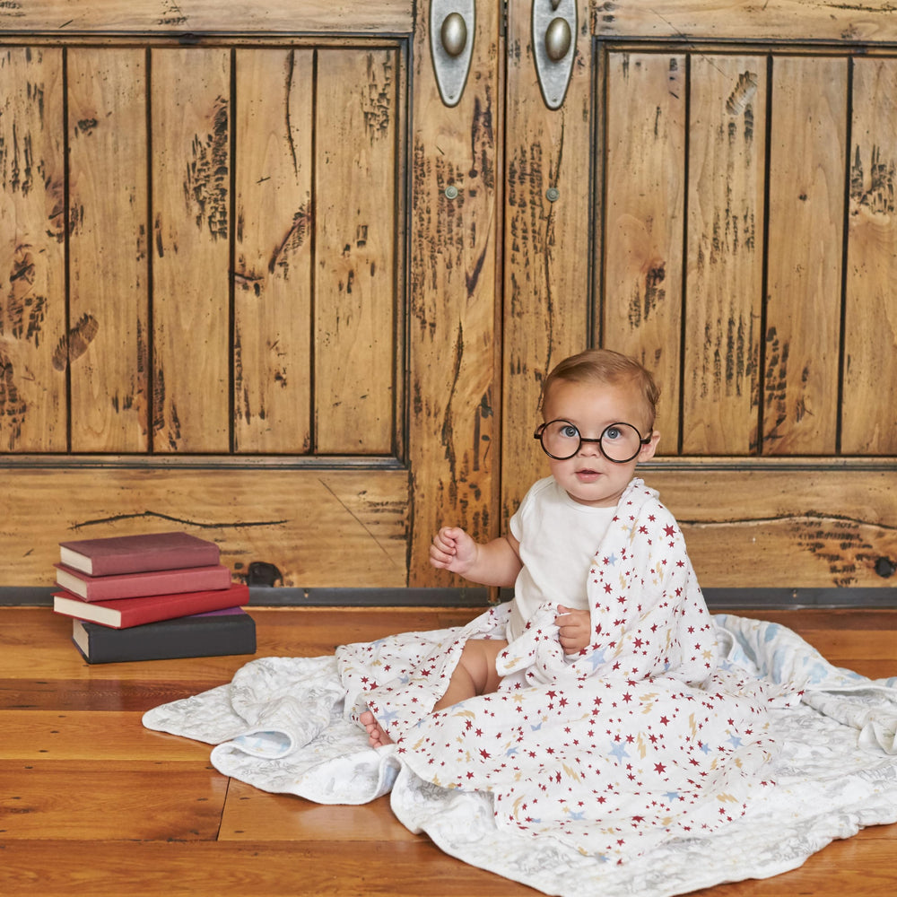 aden + anais swaddle blanket used as a receiving blanket or stroller cover