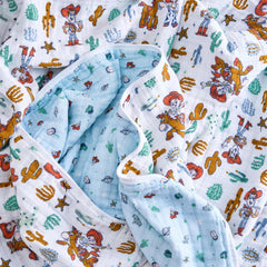 aden-anais Woody and Friends blanket in stroller reveals lightweight warmth during outings.