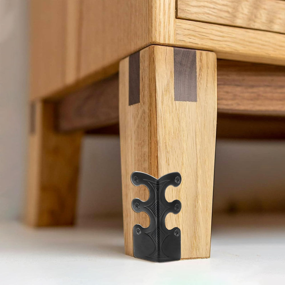 Aeloer nightstand edge protected by brass corner protectors.