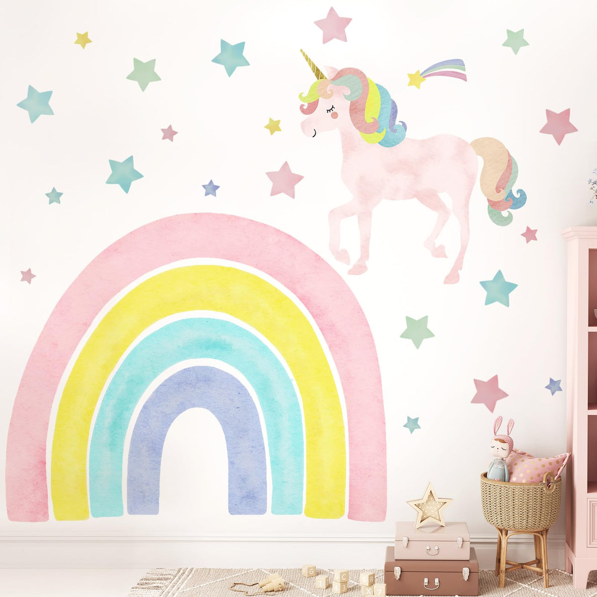 Affrolling unicorn wall decal with large rainbow creates a playful focal point in a child's room.