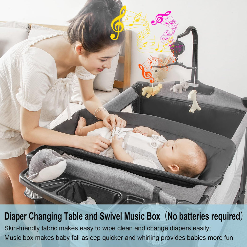 Open playard design with storage tray keeps diapers and bottles within reach.