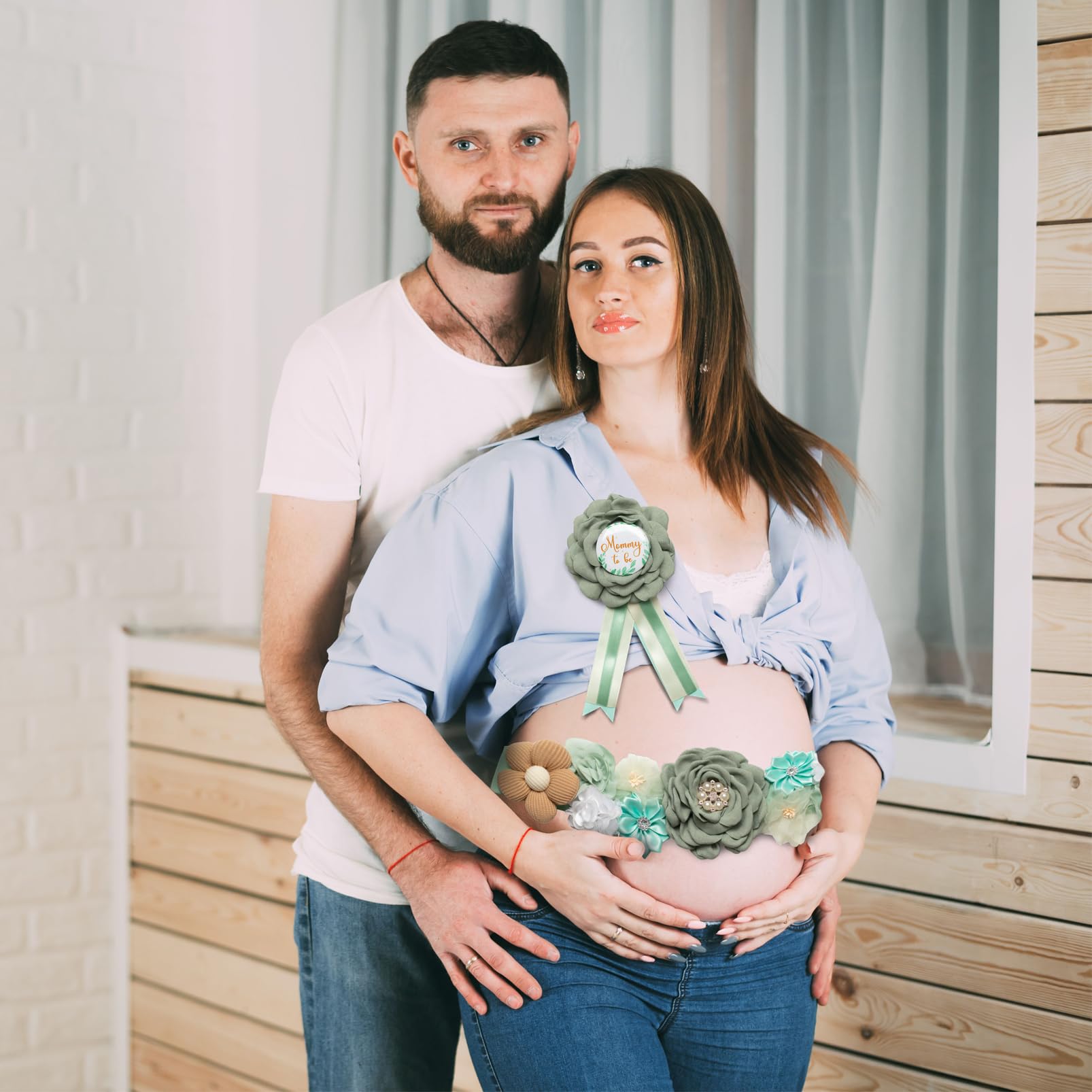 Afkengung gender reveal flowers brighten the scene with green, brown, white hues.