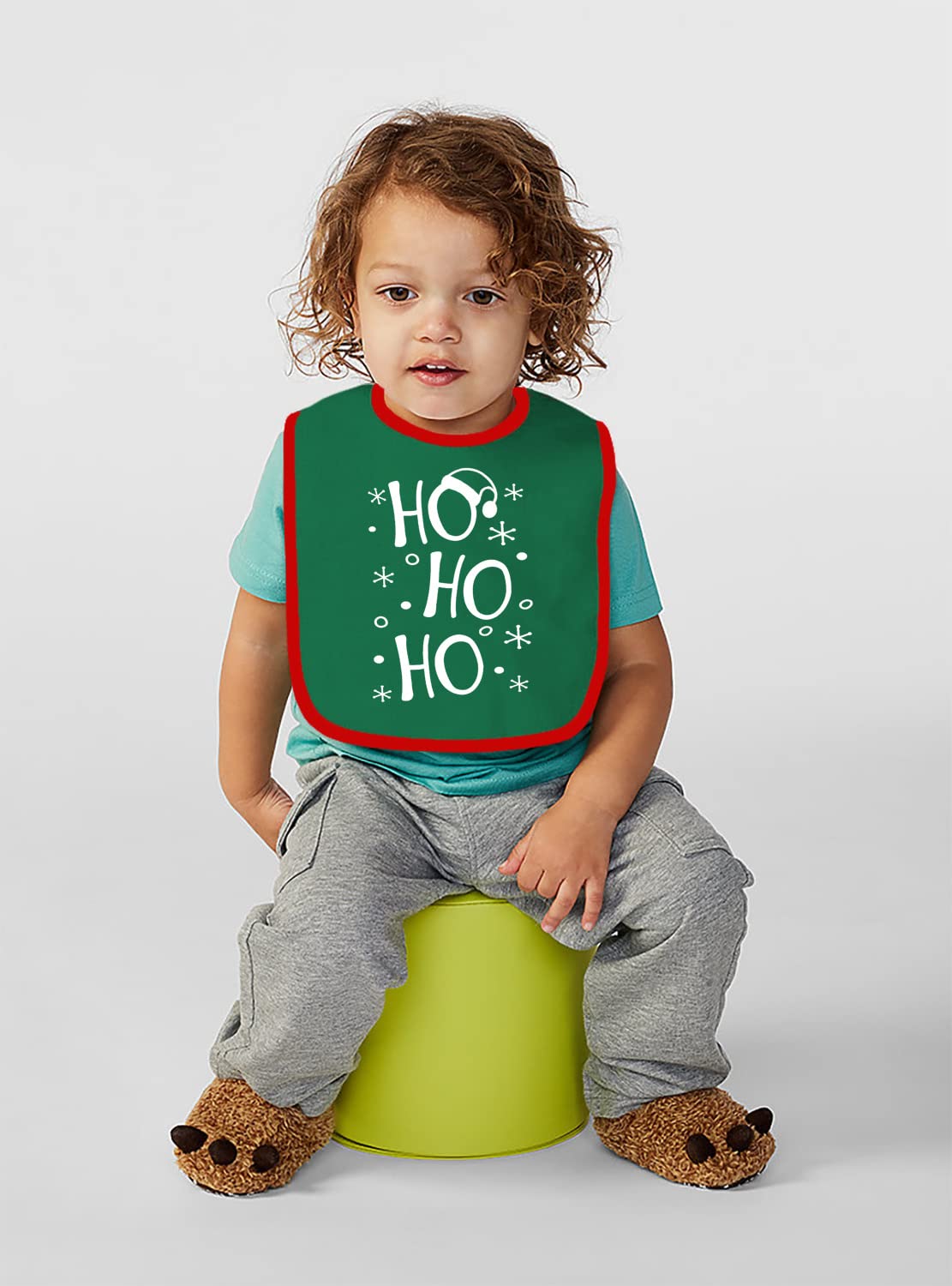 Aiden's Corner green Christmas bib closeup showing festive detail and color.