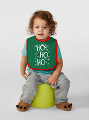 Aiden's Corner green Christmas bib closeup showing festive detail and color.