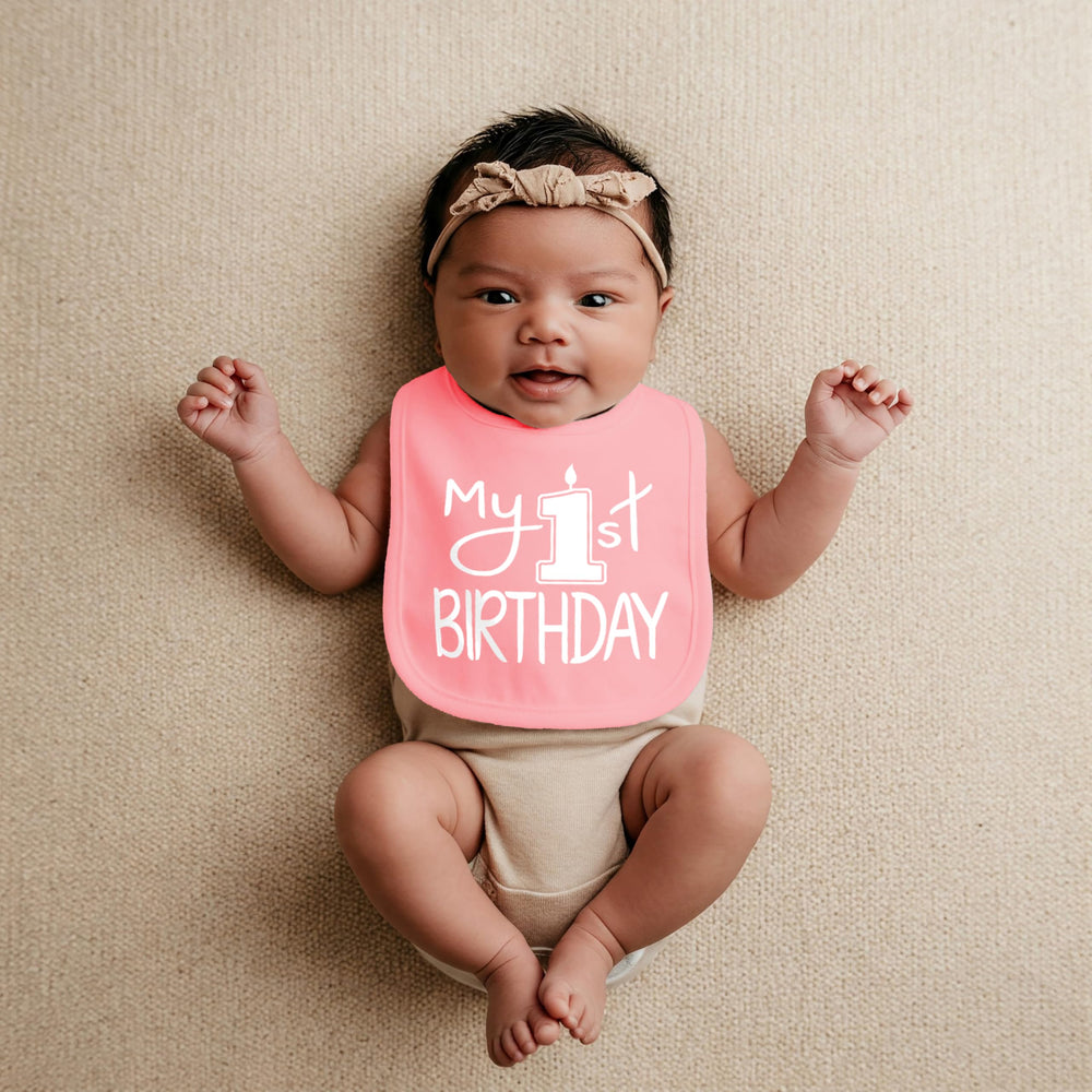 Aiden's Corner protective bib defends outfits during cake moment and play.