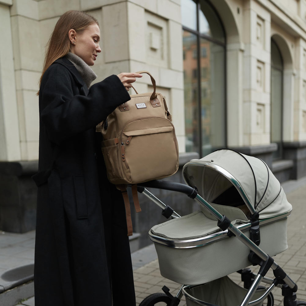 AIITA diaper bag with lightweight design and wide straps for comfortable carrying.