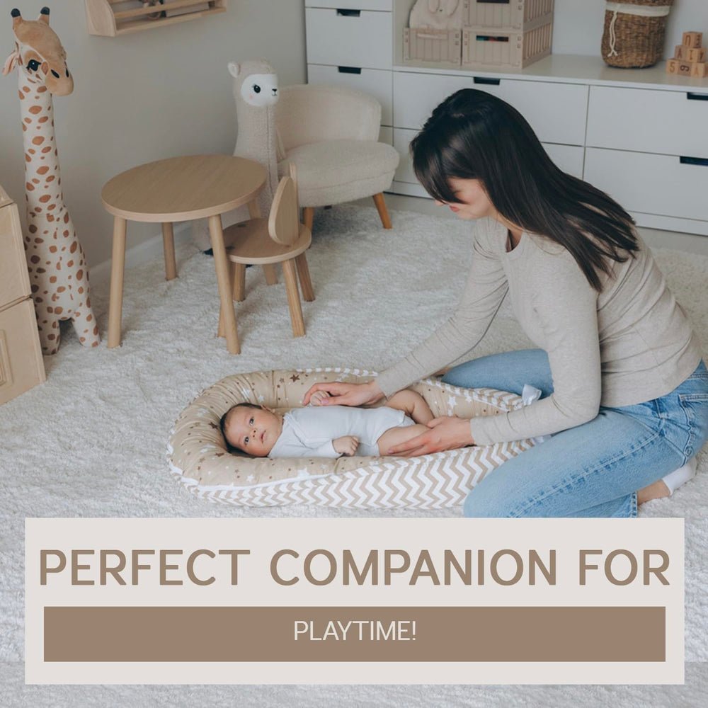 Aila+Aiden baby lounger showing its reversible design with two looks.