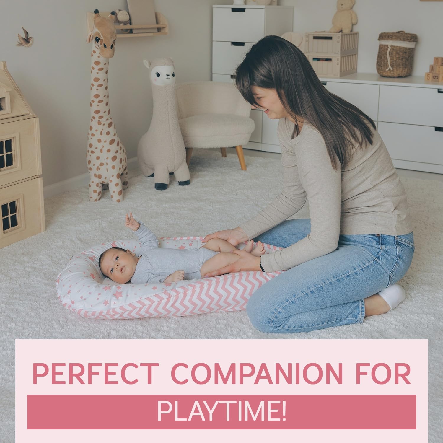 Compact, supervised-use infant lounger in pink for tummy time