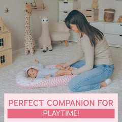 Compact, supervised-use infant lounger in pink for tummy time