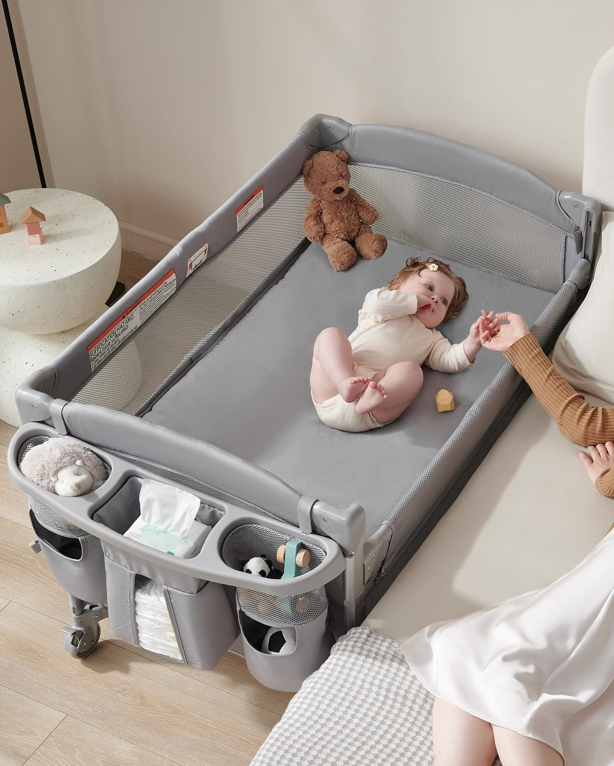 AirClub bassinet bedside sleeper with retractable side for easy night access