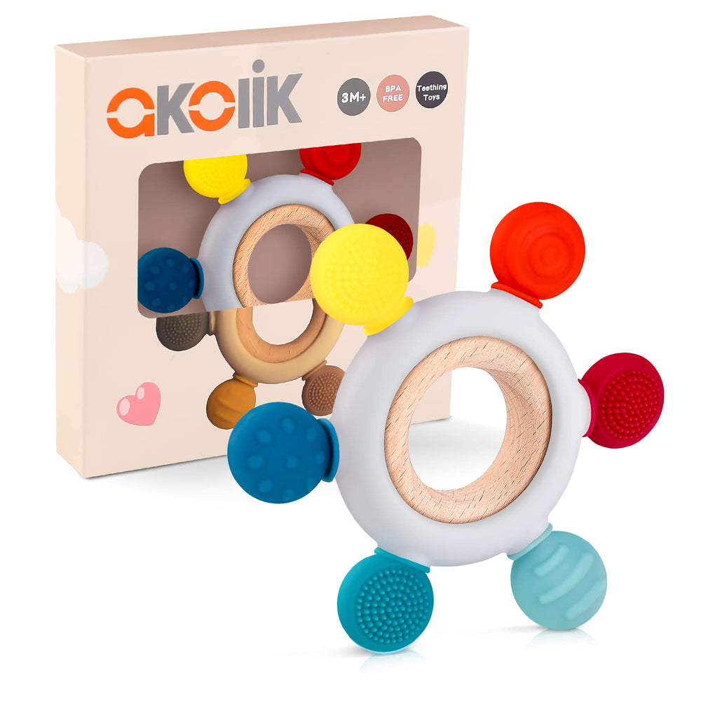 Akolik baby teether with soft bumps helps soothe gums and aid grip.