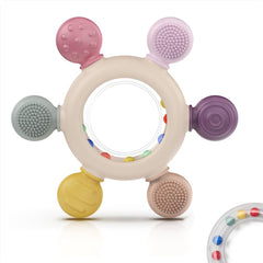Akolik teething ring in pink silicone for soothing gums and early grasp practice.