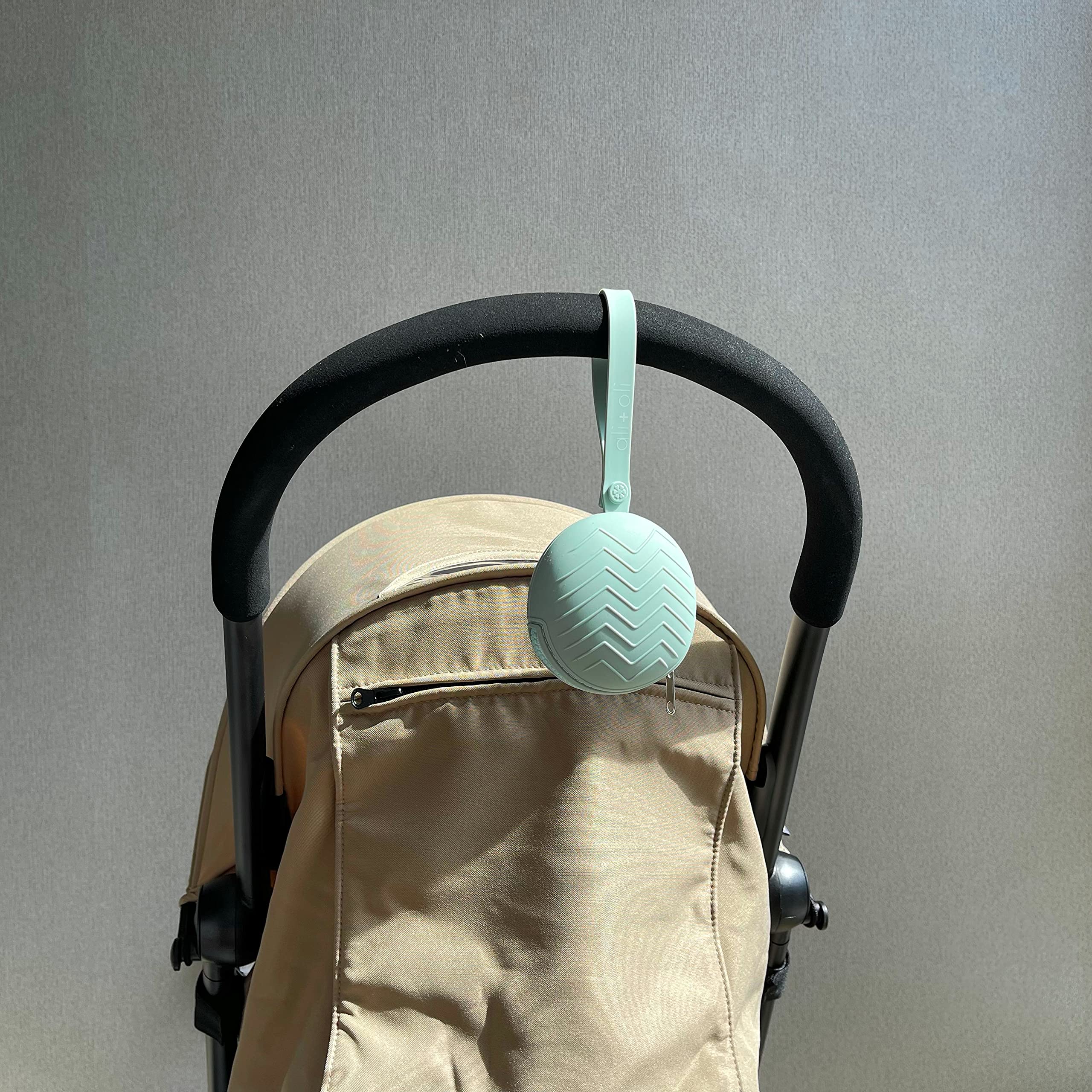 Ali+Oli multi-use case stores earbuds or lip balm.