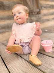 Ali+Oli Muslin Baby Bib with Snap Closure demonstrates snug fit for ages 0–24 months.