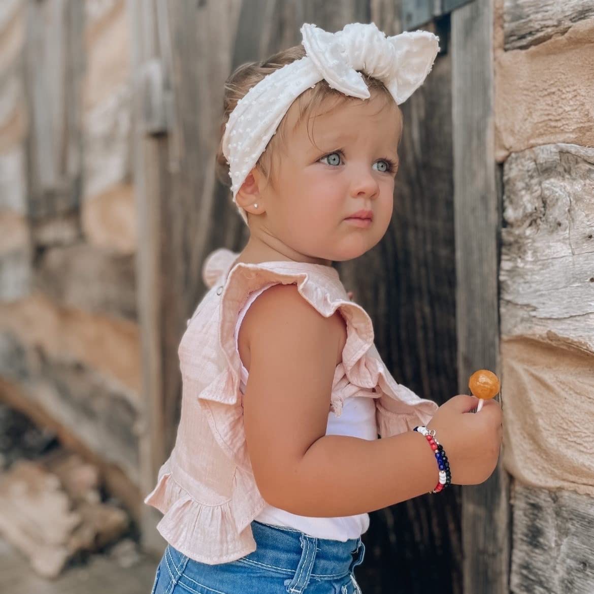 Ali+Oli Muslin Baby Bib absorbs spills while staying soft against sensitive skin.