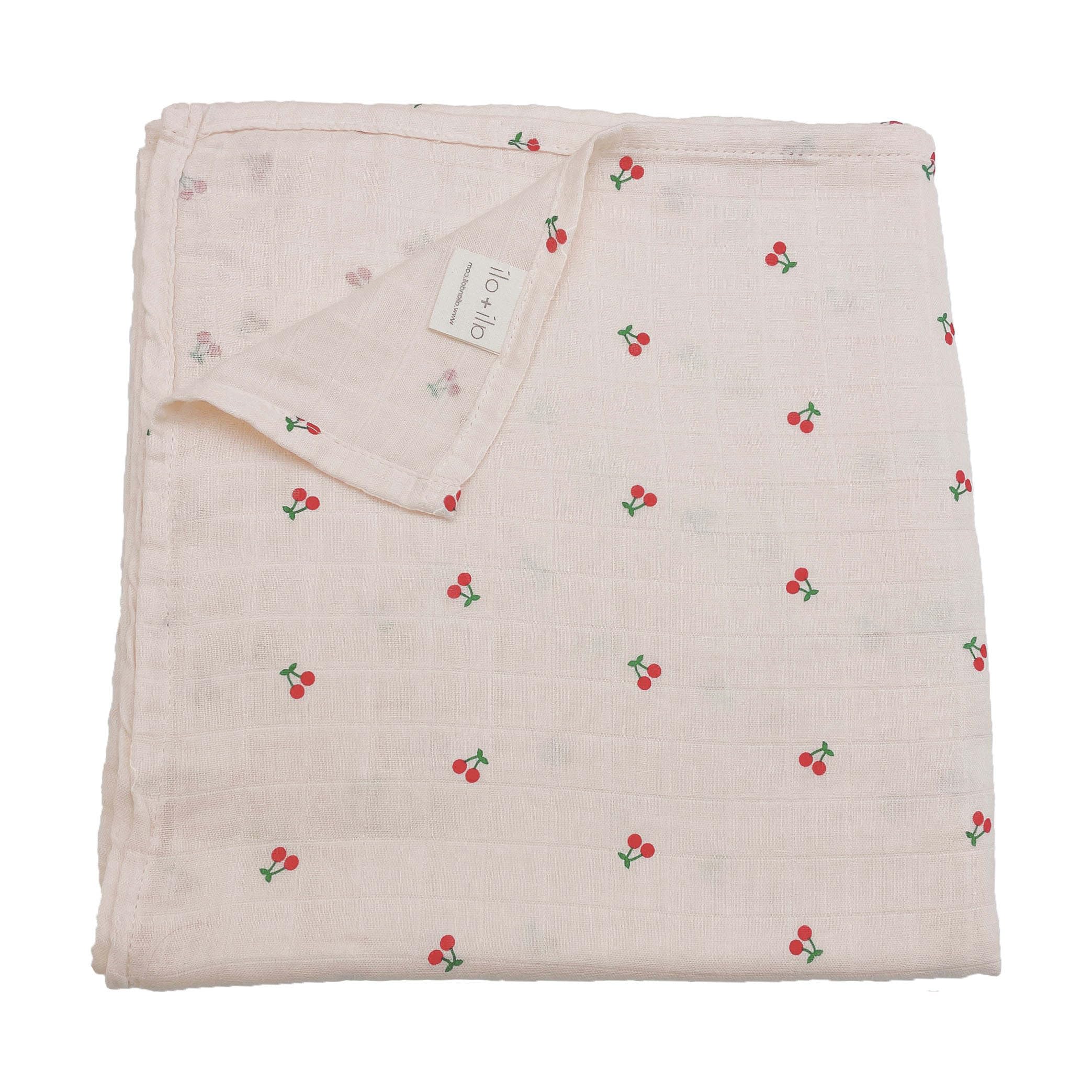 Ali+Oli Muslin Swaddle Cherry blanket offers breathable bamboo blend for delicate skin.