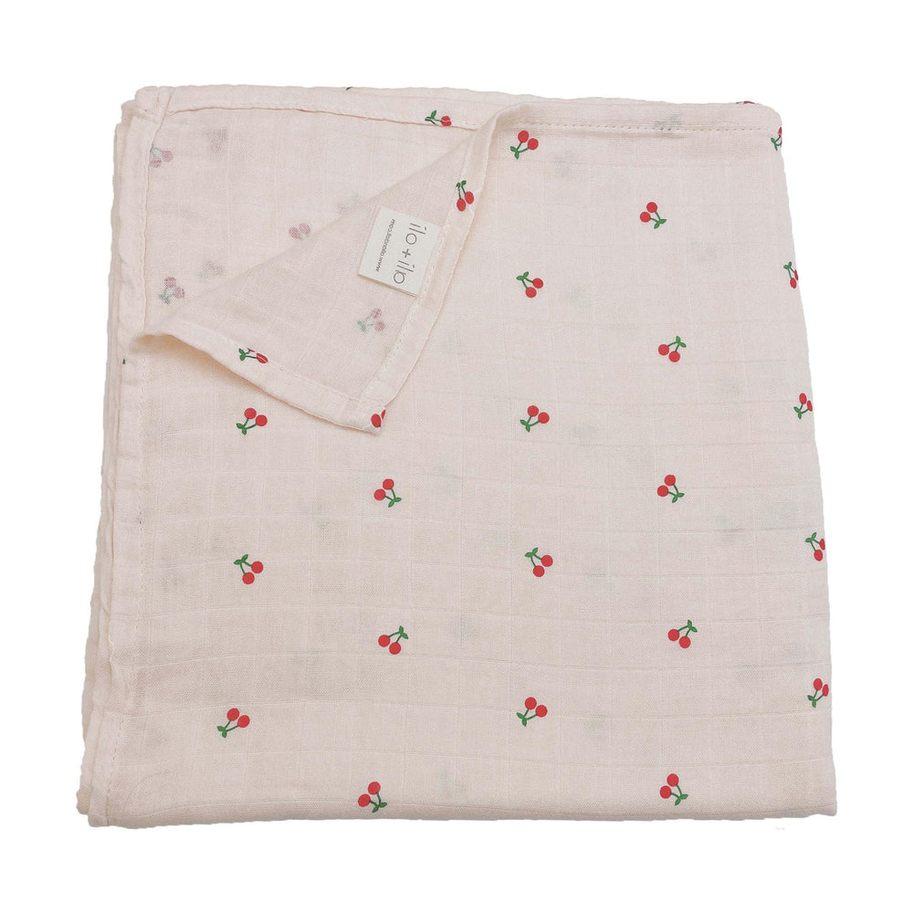 Ali+Oli Muslin Swaddle Cherry blanket offers breathable bamboo blend for delicate skin.
