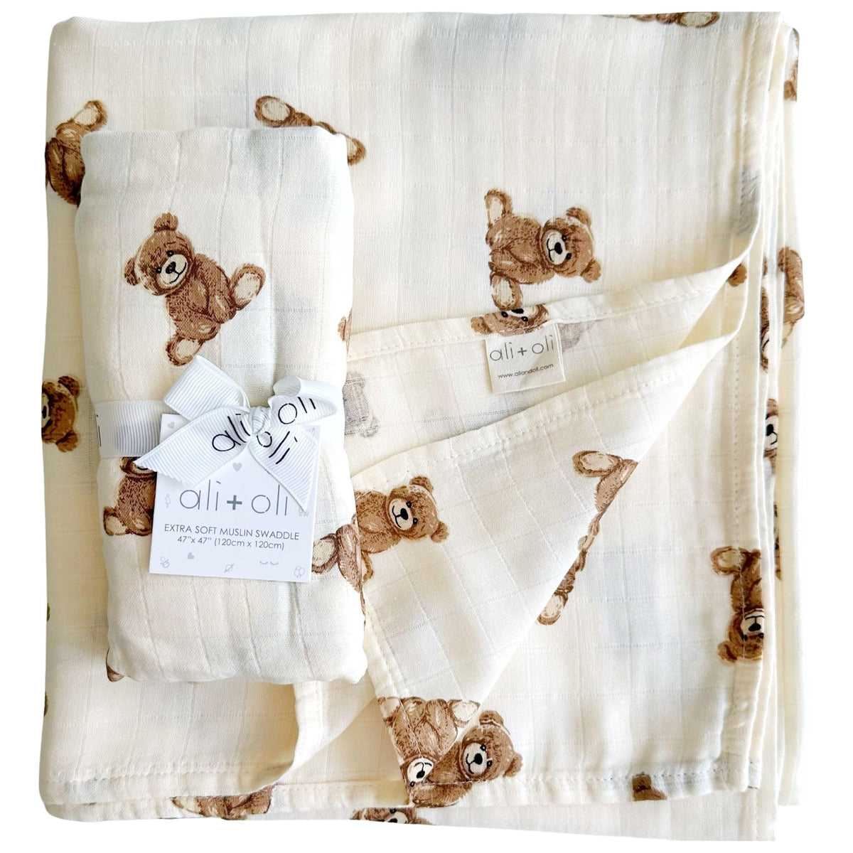 Ali+Oli swaddle blanket with teddy bear design, soft and breathable.