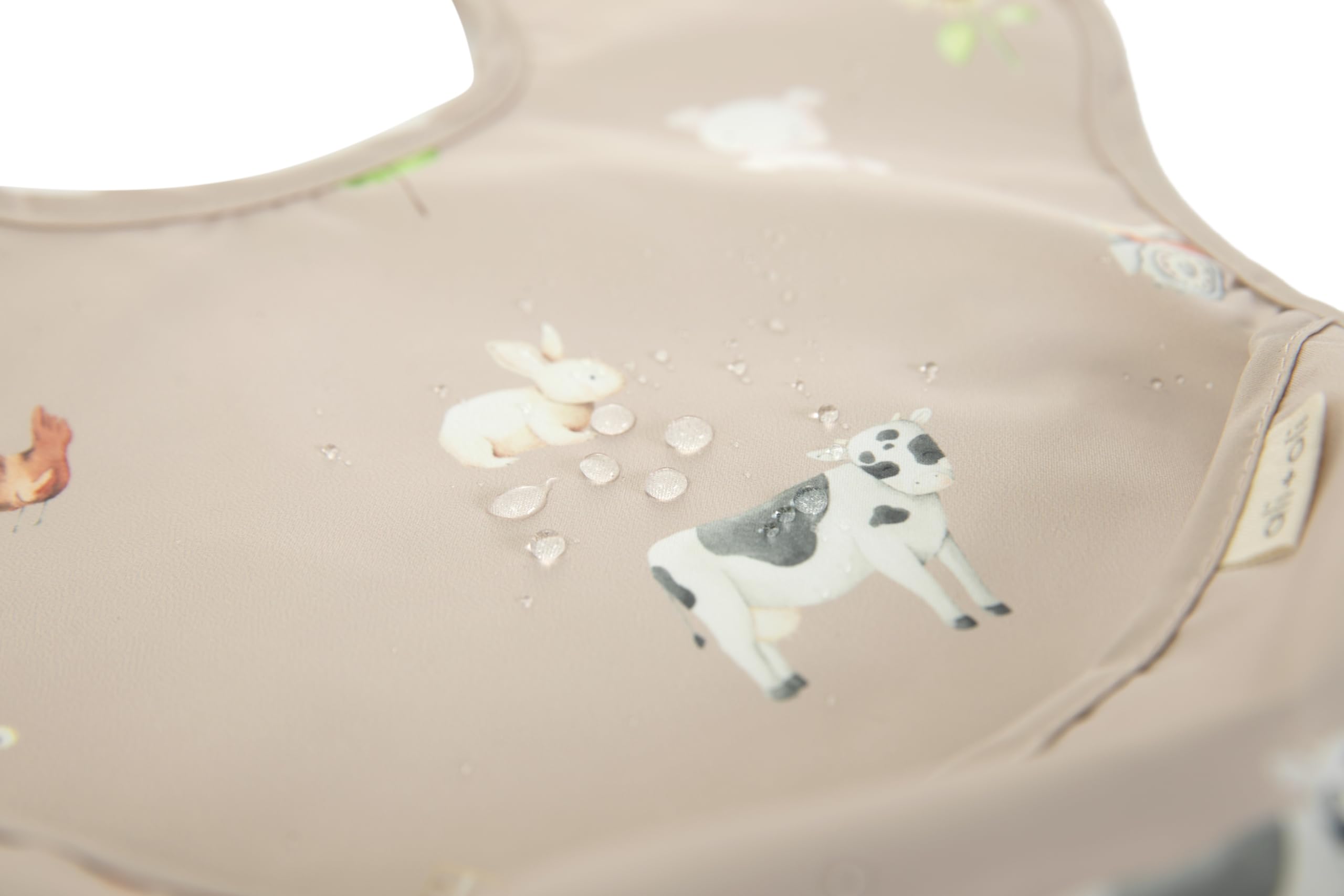 Ali+Oli Smock Bib, easy-clean surface for quick wipe-downs after meals.