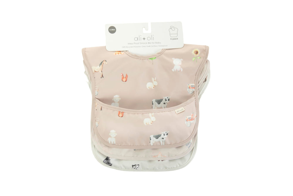 Ali+Oli Smock Bib, travel-ready and foldable for on-the-go meals.