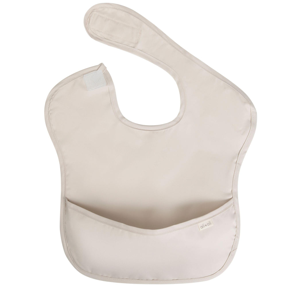 Ali+Oli baby smock worn during feeding reduces mess and spills