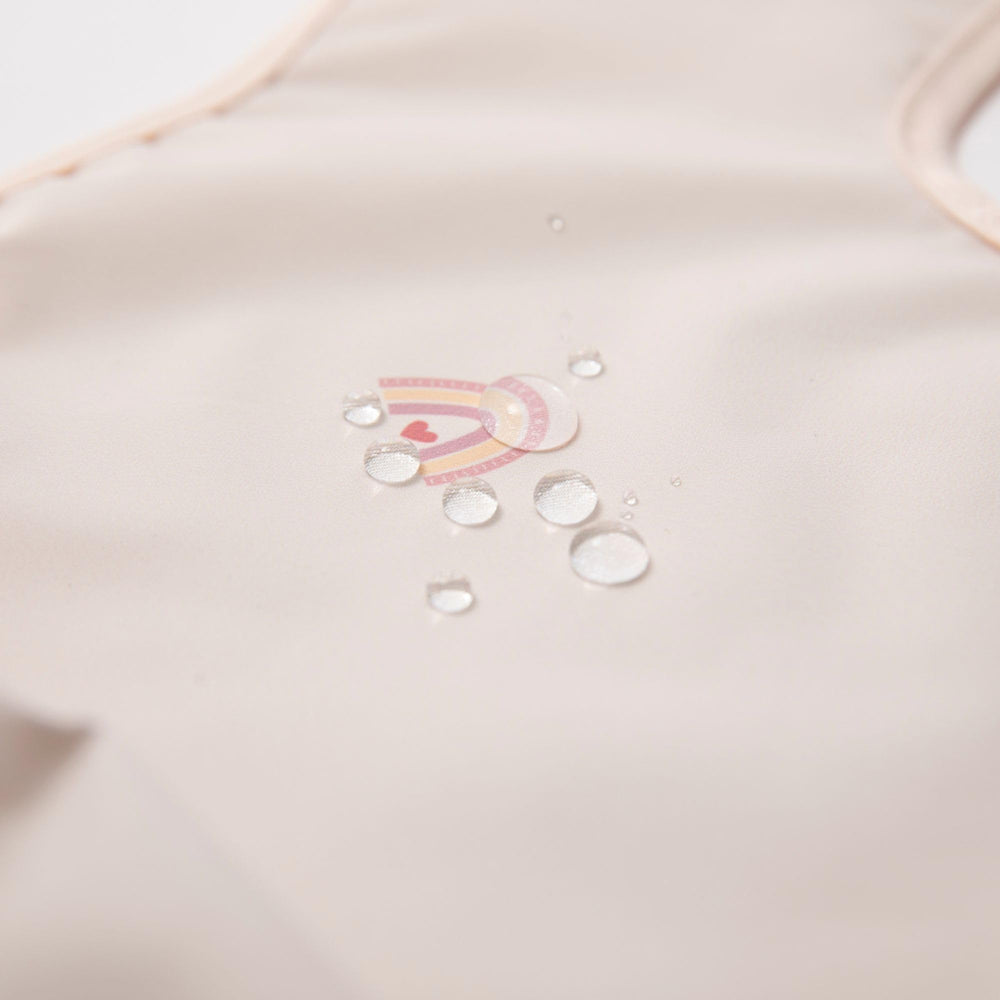 Ali+Oli Smock Bib close-up neck trim reveals soft, skin-friendly design.