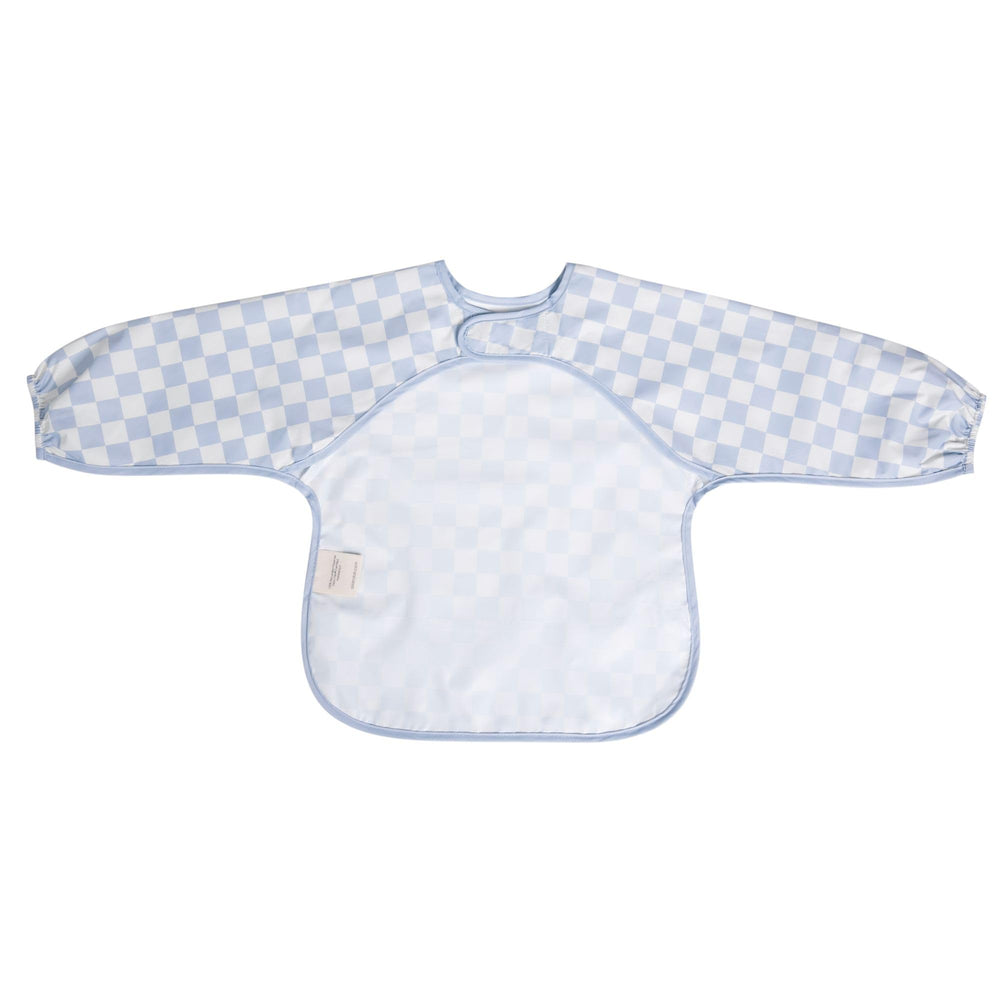 Ali+Oli blue checkers smock bib in a mealtime scene with baby.