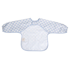 Ali+Oli blue checkers smock bib in a mealtime scene with baby.