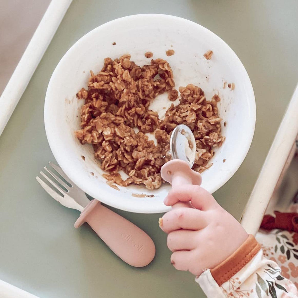Two-piece set supports stage-based self-feeding development and independence