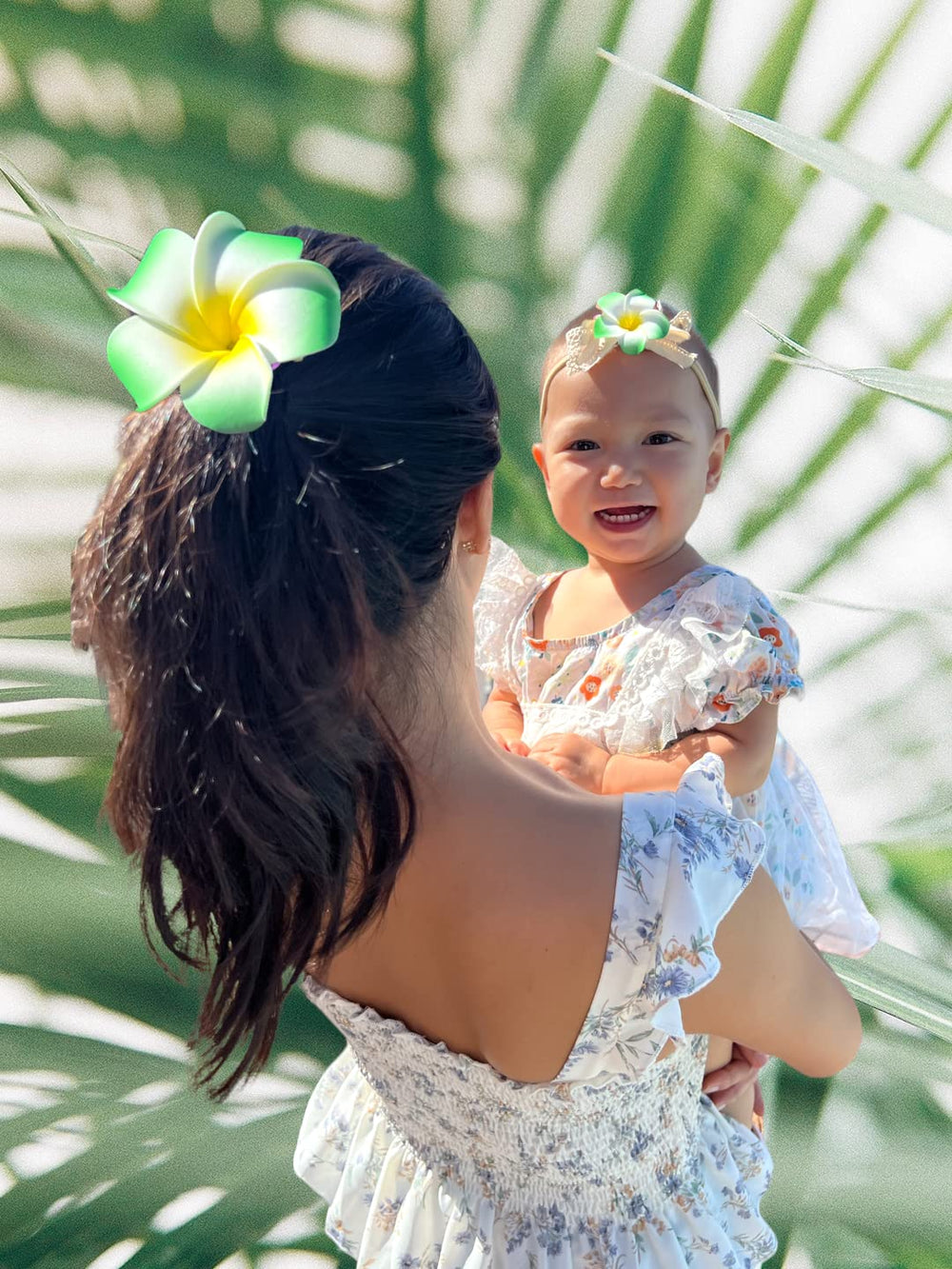 Close-up of All Things Lani plumeria clip in Grass