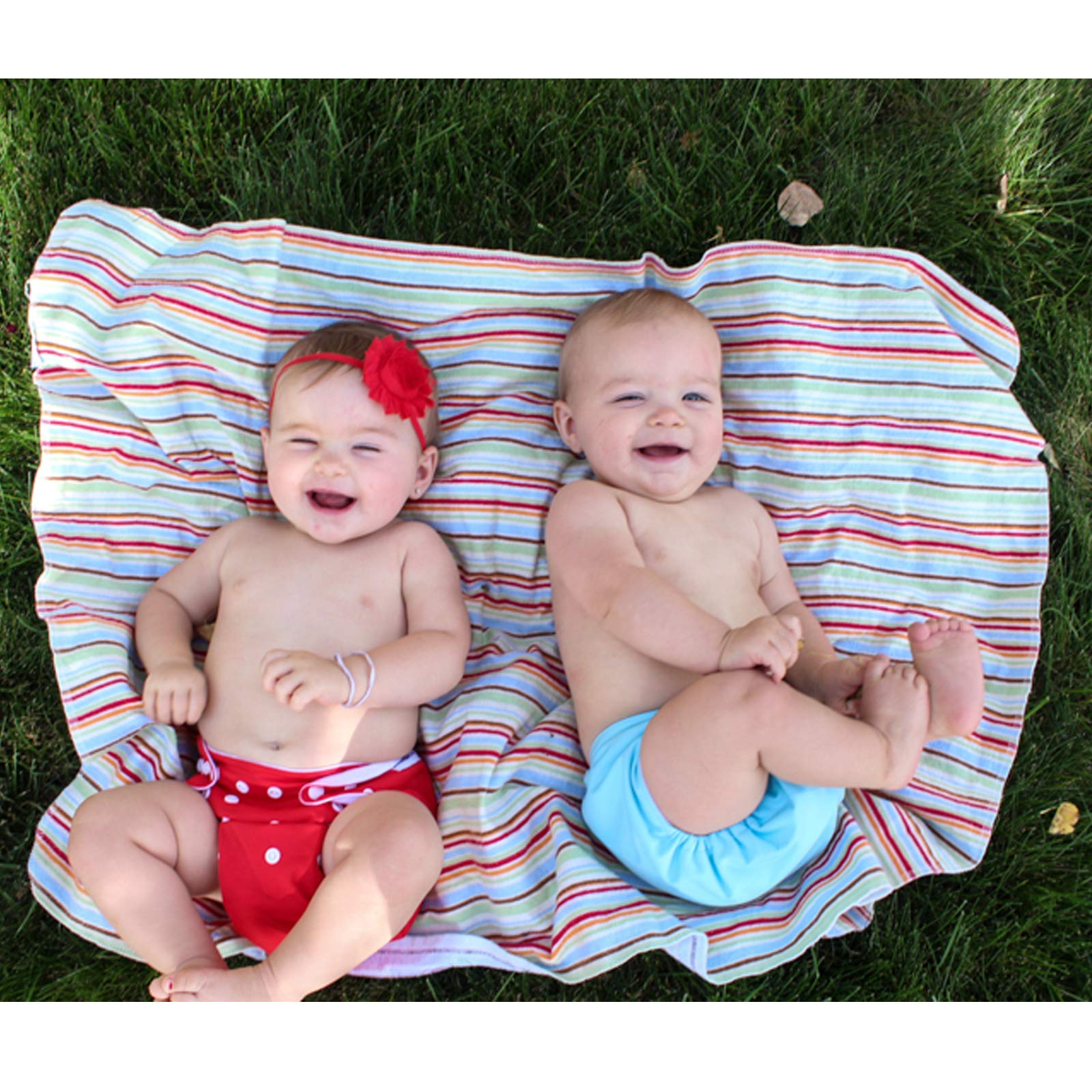 ALVA BABY hip/crossover snaps—prevents wing droop for secure fit.