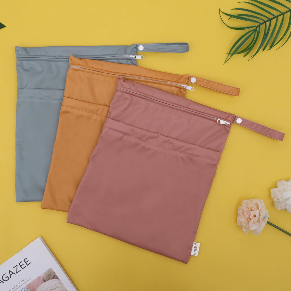 ALVABABY bag demonstrates spacious capacity for multiple cloth diapers.