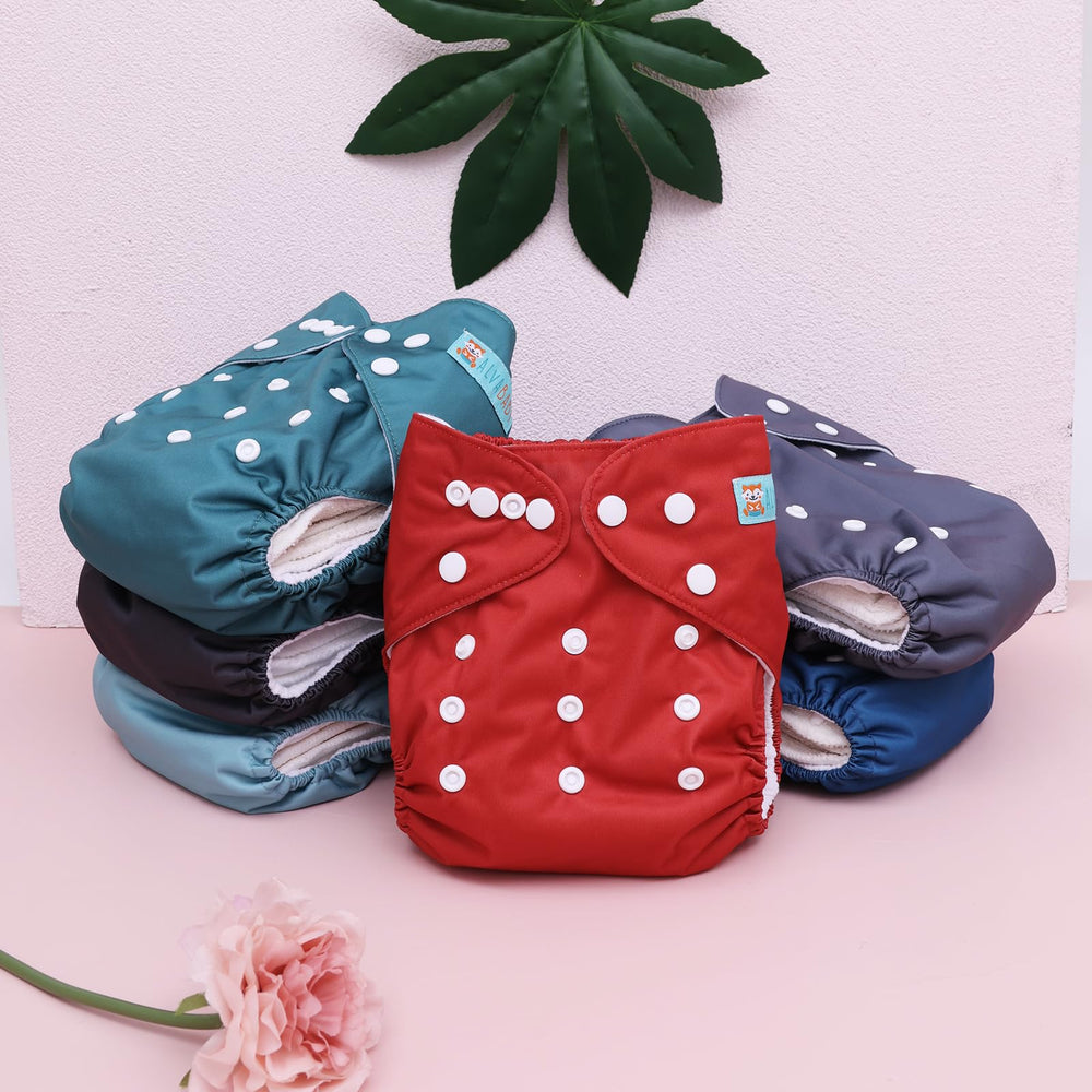 ALVABABY hip and crossover snaps secure fit to prevent leaks