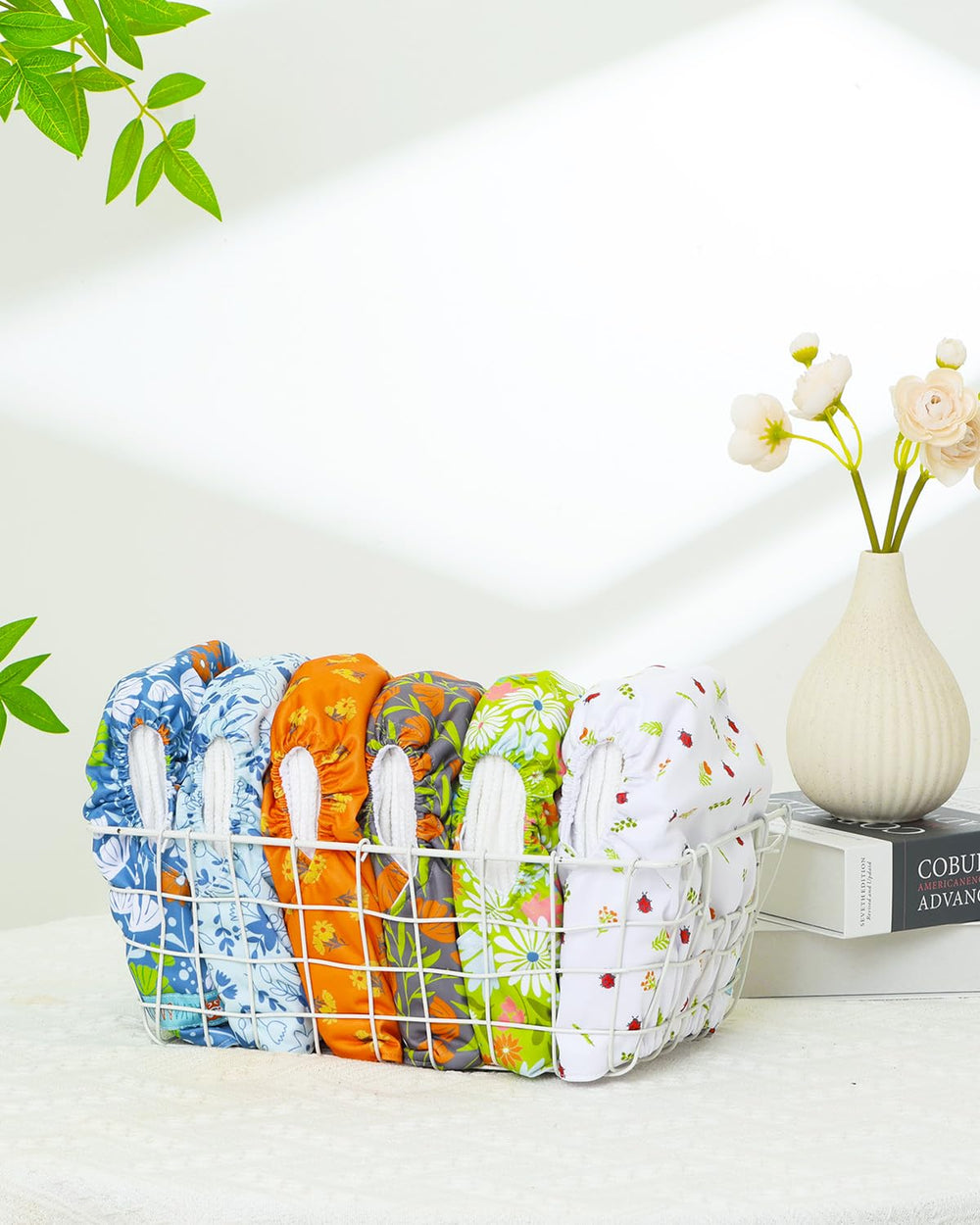 ALVABABY packaging shows 6 diapers and 12 inserts for a complete set.