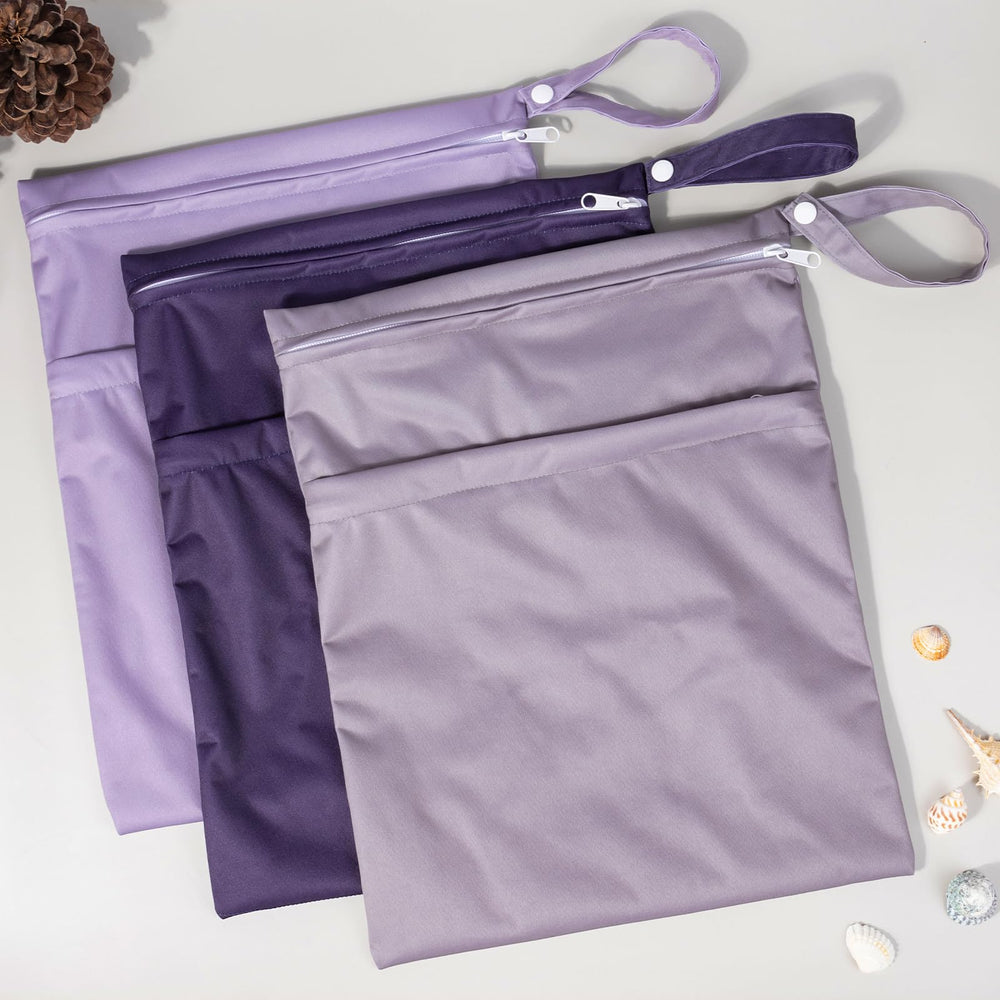ALVABABY wet-dry bag in use for travel keeps swimsuits organized.