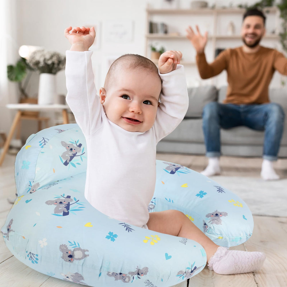AMASKY nursing pillow used across feeding, play, and early sitting.