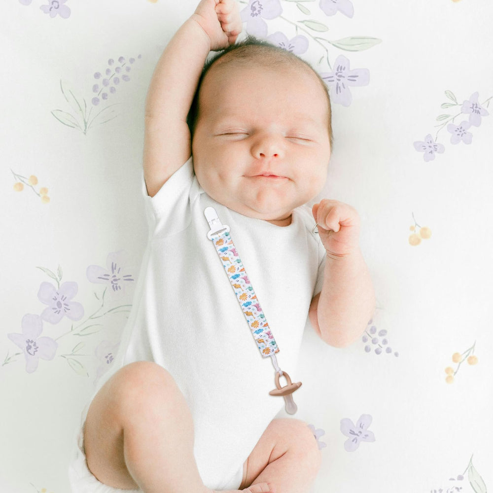 AmazingM dinosaur clips coordinate with newborn essentials and outfits.