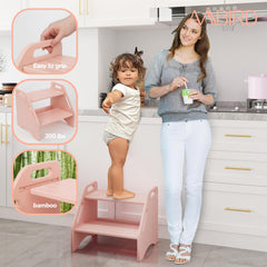 AMBIRD pink two-step stool front view shows easy access with handles for toddlers.