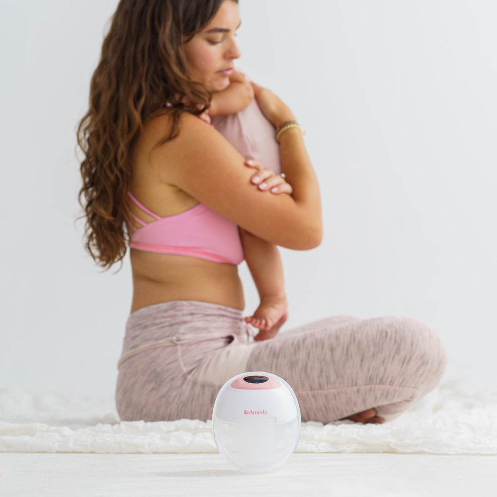 Ameda GLO collection cup attached to the pumping assembly for easy setup.