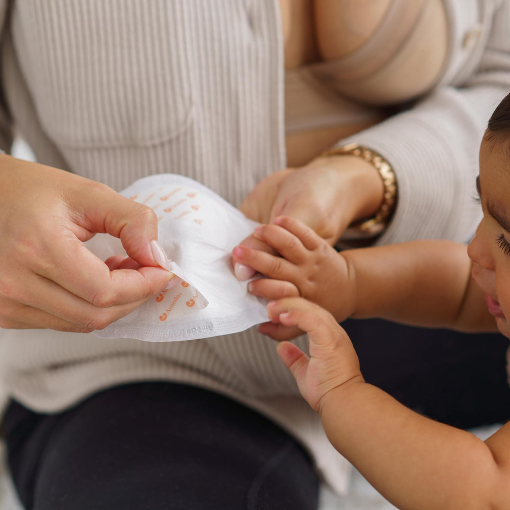 Ameda MoistureGuard pad with adhesive strip stays secure