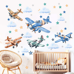 Amimagen airplane wall sticker with clouds and stars for a playful nursery decor.