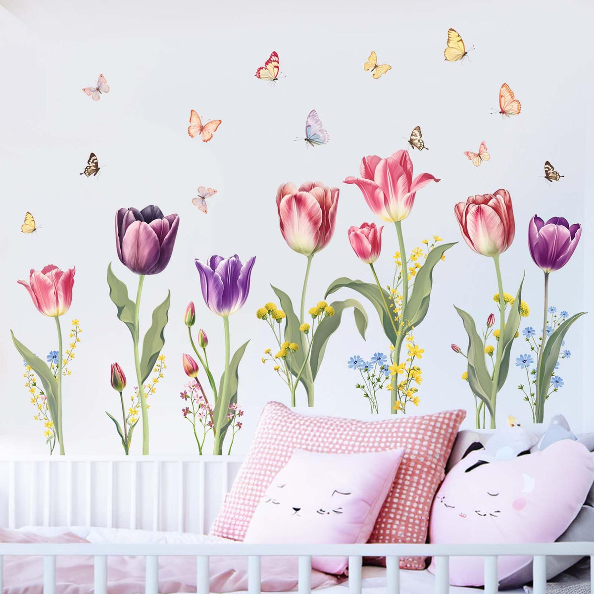 Amimagen pink tulip wall decals create a bright focal point in a girl's bedroom.