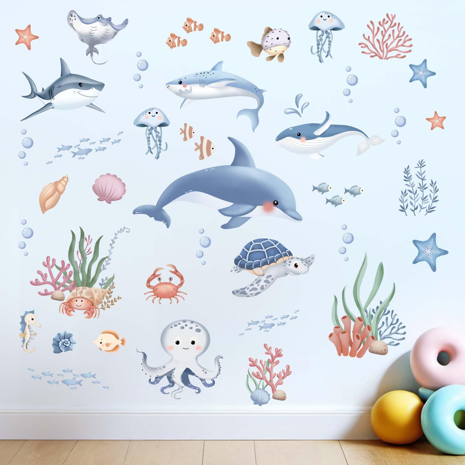 Amimagen ocean whale wall sticker creates a calming nursery seascape.