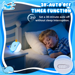 Ammonite Blue Narwhal night light on a nursery shelf in use