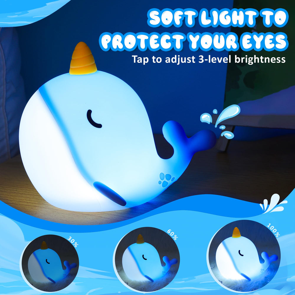 Ammonite Blue Narwhal night light showing three brightness levels
