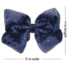 AMYDECOR navy blue sequin bow clip close-up shows secure alligator clip