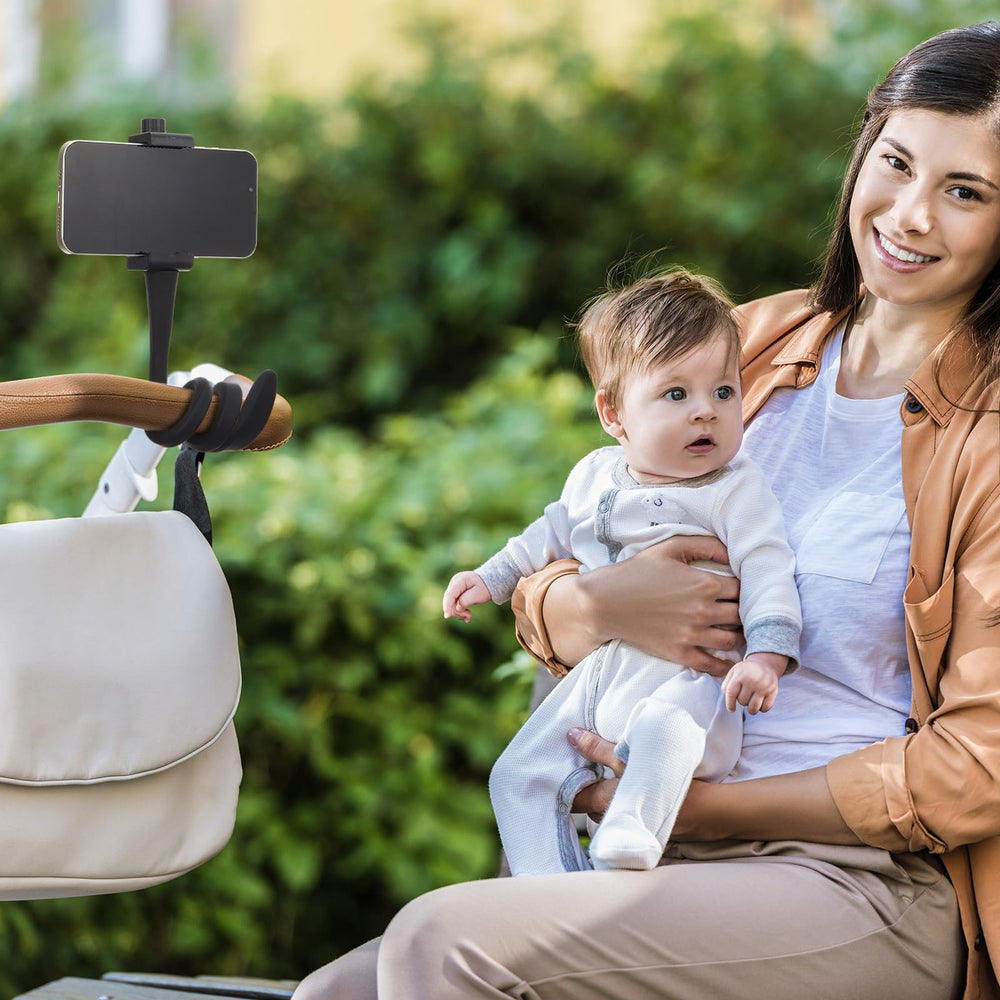 Amylove stroller phone holder in use during a baby stroller outing.